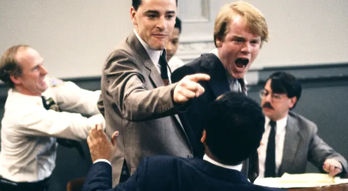 Philip Seymour Hoffman points during heated courtroom argument scene