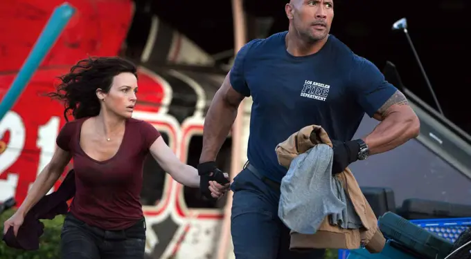 man in fire department shirt pulls woman while running near helicopter