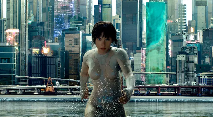 Major Motoko Kusanagi in white bodysuit rises from water in city
