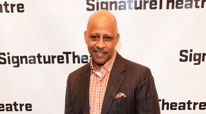 Ruben Santiago Hudson in pinstripe suit at Signature Theatre event
