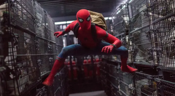 Spider-Man crouches in a cargo hold scene from Spider-Man: Homecoming