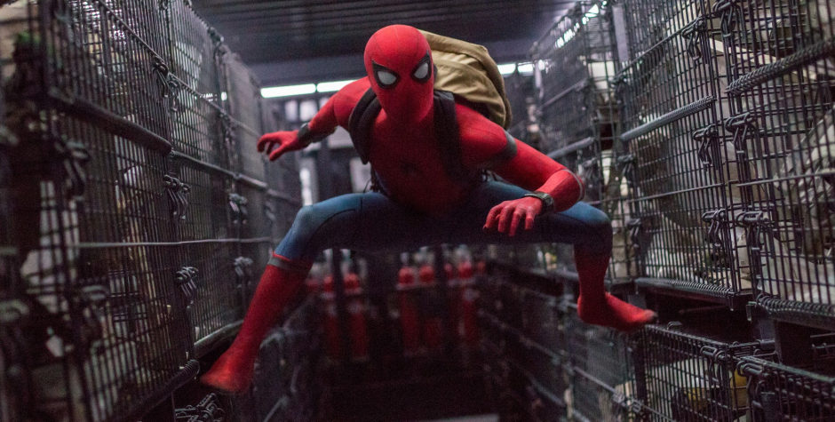 Spider-Man crouches in a cargo hold scene from Spider-Man: Homecoming