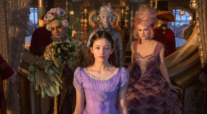 Scene featuring four elaborately dressed characters in The Nutcracker and the Four Realms
four costumed characters stand in an ornate room from The Nutcracker