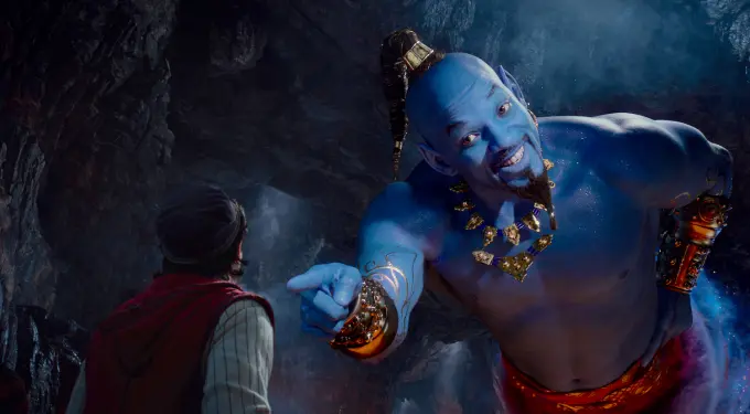 Will Smith playing Genie in Disney’s live-action Aladdin
Will Smith as blue Genie gestures while speaking to Aladdin