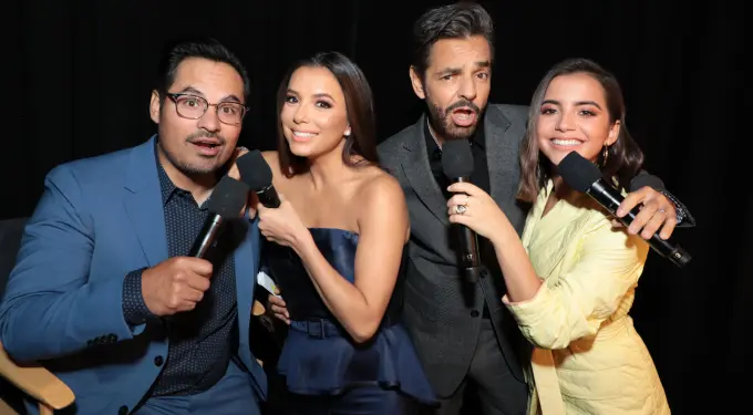 Michael Pena, Eva Longoria, Eugenio Derbez, and Isabela Moner at CinemaCon promoting Dora and the Lost City of Gold
Michael Pena, Eva Longoria, Eugenio Derbez, Isabela Moner smiling with microphones