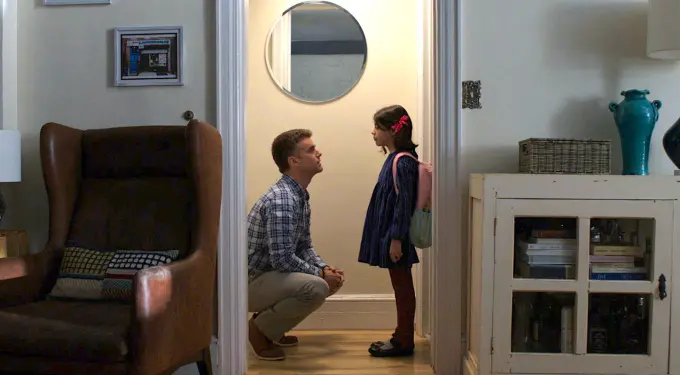 ‘Seneca’ starring Armando Riesco
Man in plaid shirt crouches talking to young girl in hallway