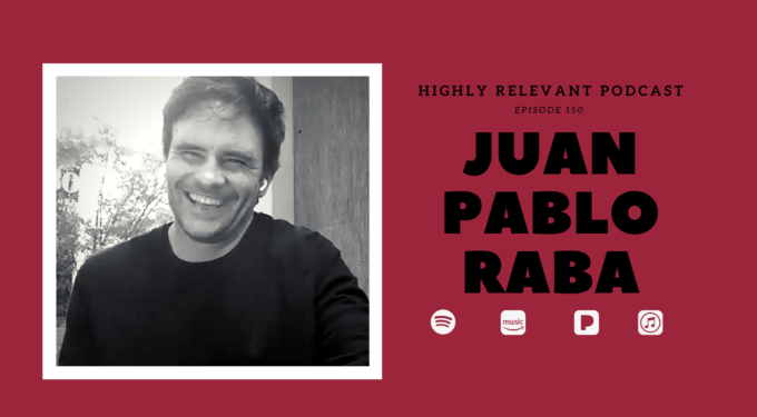 Juan Pablo Raba featured on Highly Relevant Podcast episode 150 discussing border stories.
Juan Pablo Raba smiling in black and white headshot during podcast