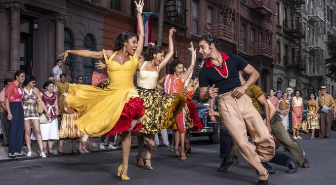 Dancers performing a street dance sequence in Steven Spielberg’s West Side Story.
Actors dancing vibrant street scene from West Side Story musical