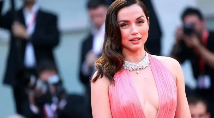 Ana de Armas in pink dress on red carpet at awards event