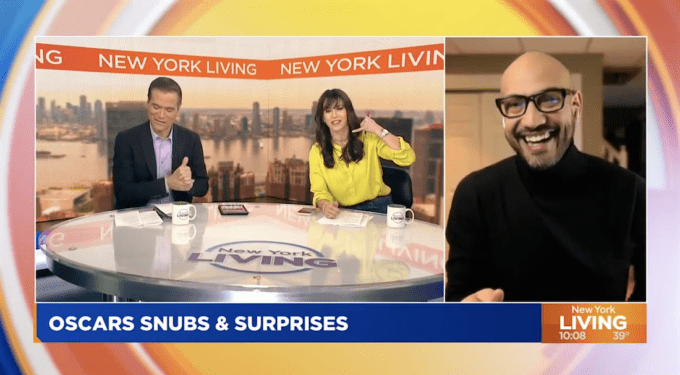Jack Rico discussing Oscar snubs and surprises on New York Living
Two TV hosts sit at desk, man smiles in virtual interview about Oscars