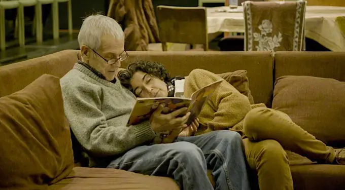 Scene from The Eternal Memory, a Chilean film at 2023 Sundance Film Festival
Older man and woman read magazine together on brown couch