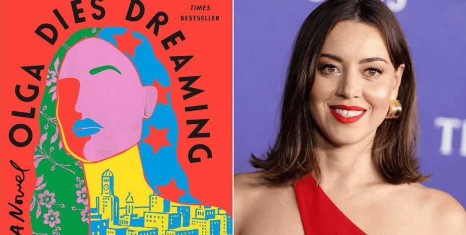 Aubrey Plaza attends a public event wearing a red one-shoulder dress.
Aubrey Plaza smiles wearing red dress at red carpet event