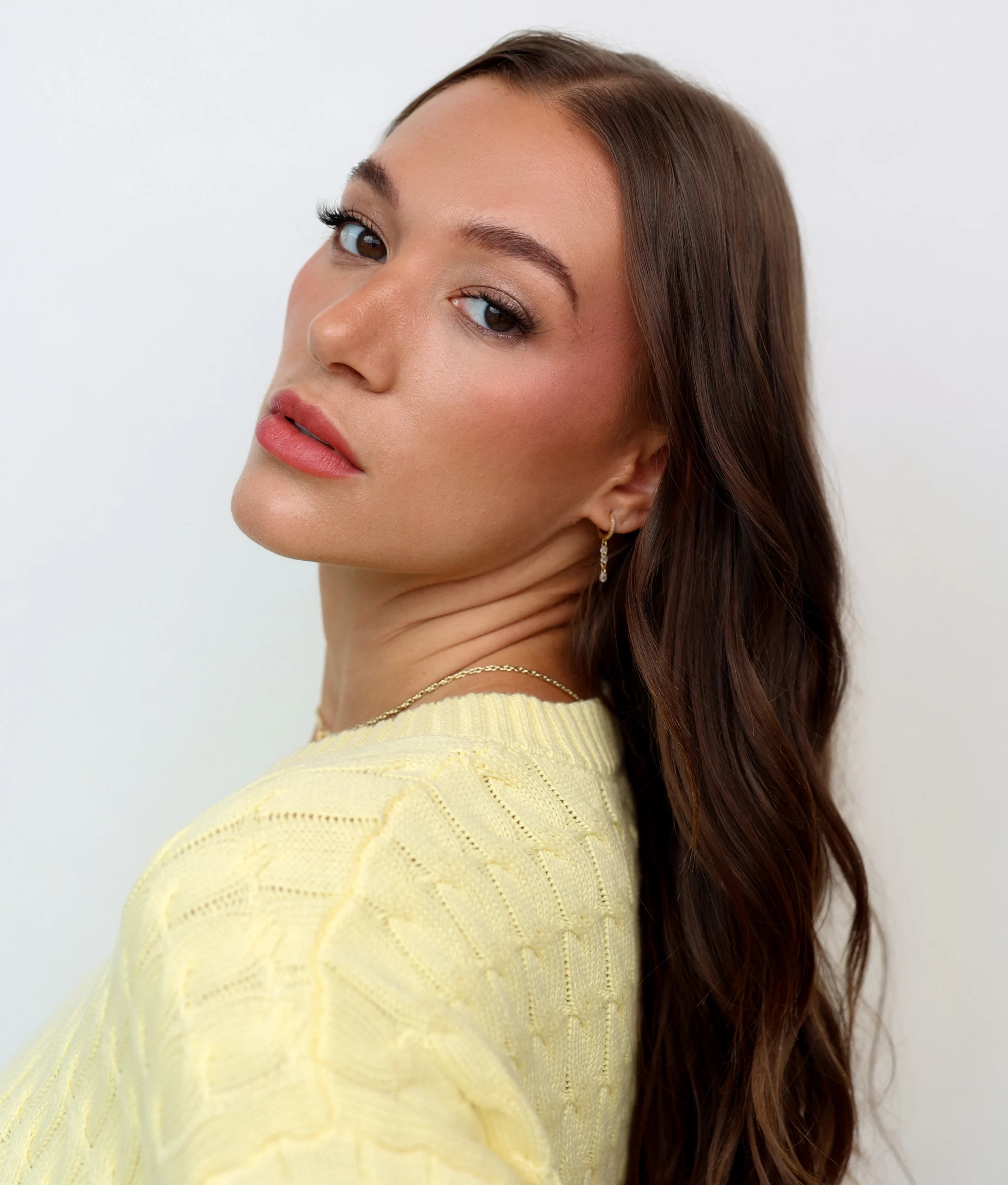 Jess Val Ortiz in a yellow sweater